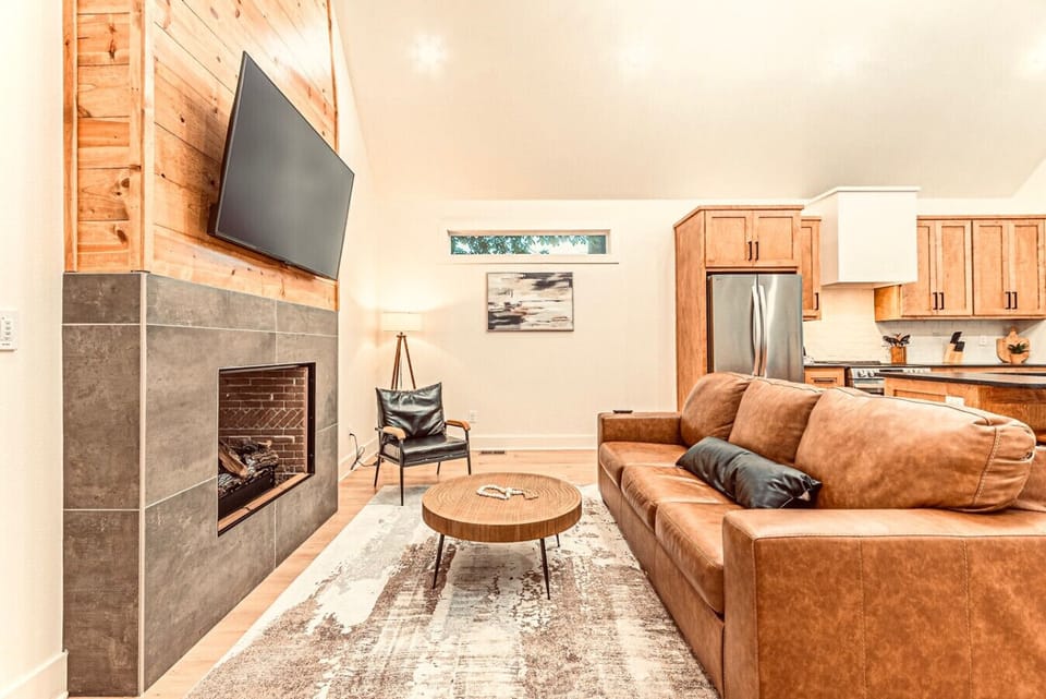 Living Room Oasis: Stylish retreat with a sleek fireplace and inviting seating for relaxation!