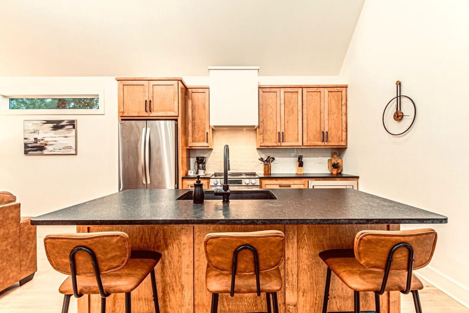 Kitchen Paradise: Enjoy modern appliances and stylish seating perfect for culinary adventures!