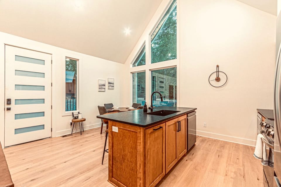 Kitchen: Enjoy culinary adventures in this sleek, sunlit space with modern finishes and views!