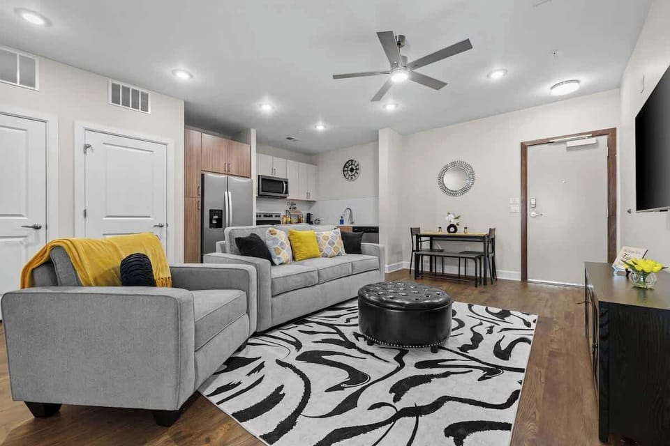 Open living area w/ comfy seating & bold patterns