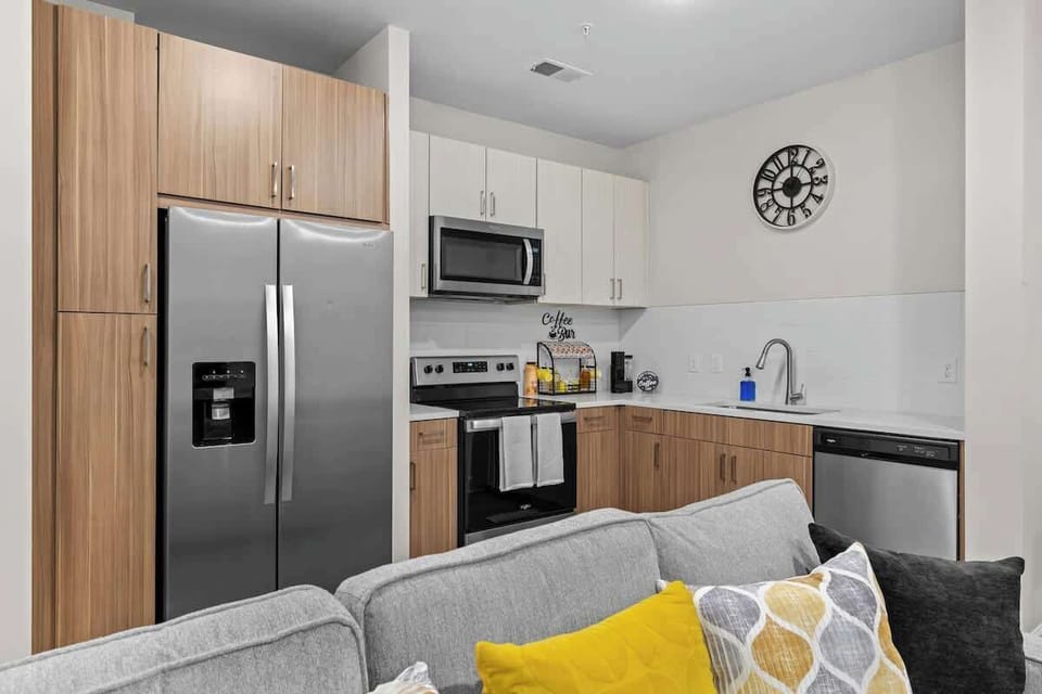 Modern kitchen stocked w/ clean lines & bright light