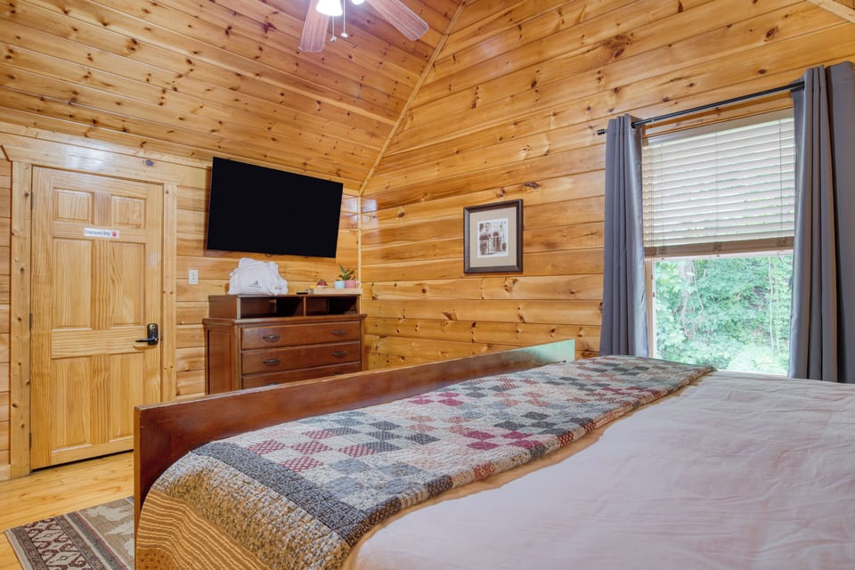 Primary Bedroom with King bed, TV, and ensuite bathroom access.
