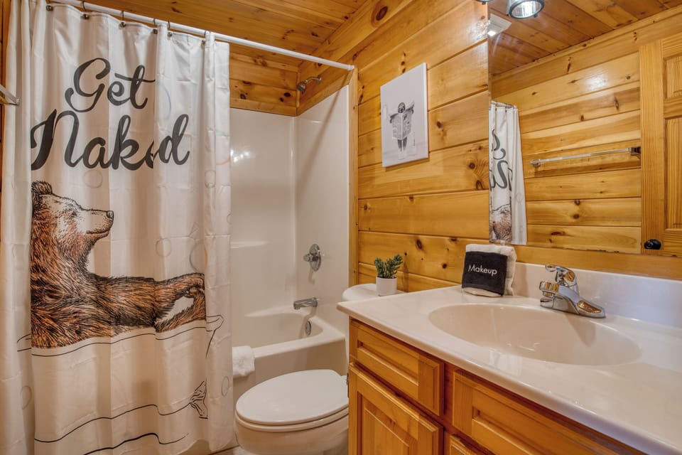 Private ensuite bathroom featuring a shower/tub combo, single vanity, and toilet. Attached directly to the Primary Bedroom.
