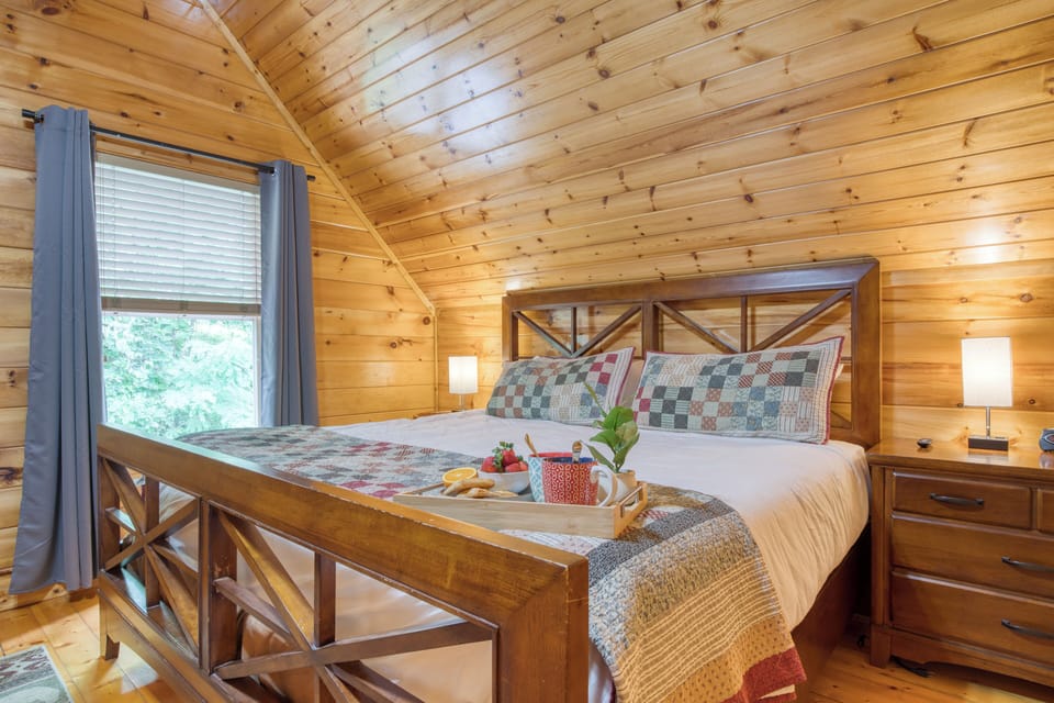 Primary Bedroom with King bed, TV, and ensuite bathroom access.
