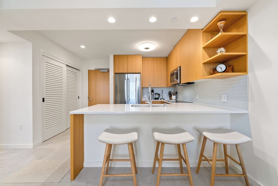 Enhance your dining experience with the kitchen island and barstool seating.