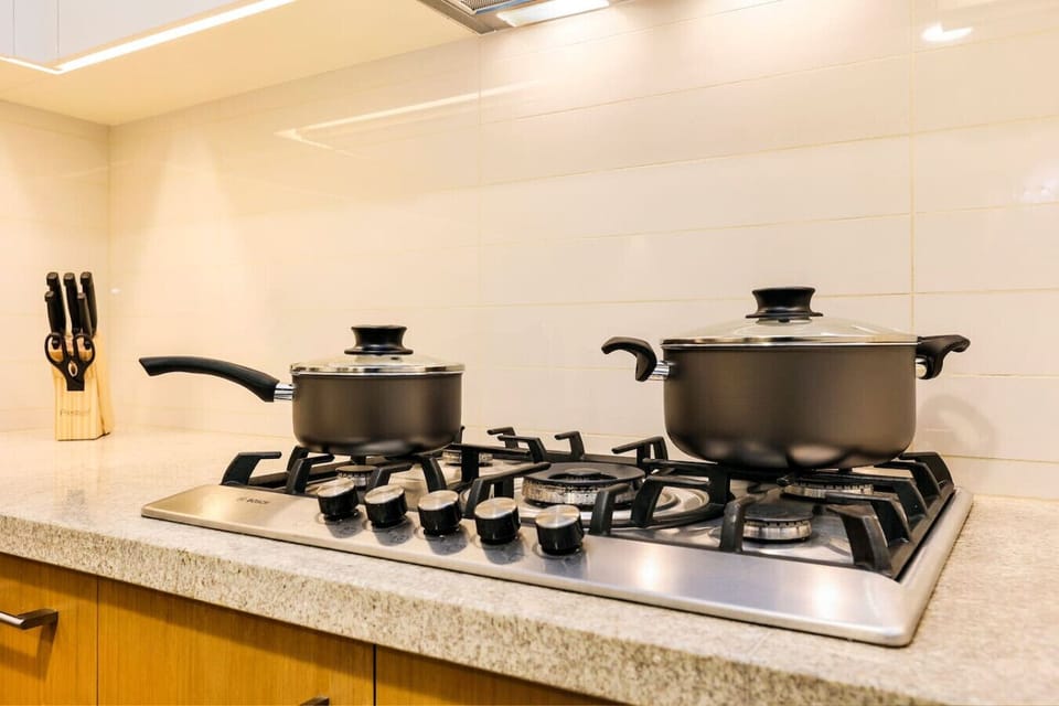 Kitchen: Whip up culinary delights in this sleek, fully-equipped kitchen with modern appliances!