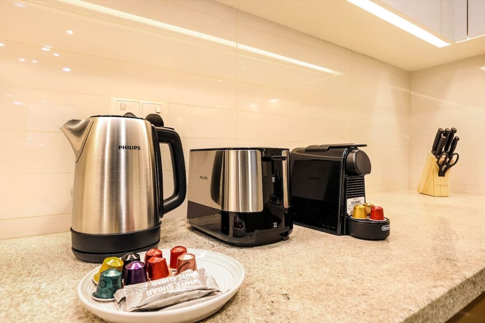 Modern Kitchen Corner: Enjoy your morning brew with stylish appliances and a splash of color!