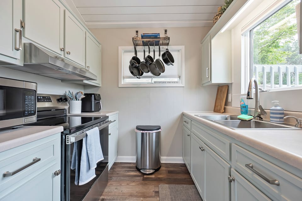  Modern galley kitchen with stainless steel appliances.