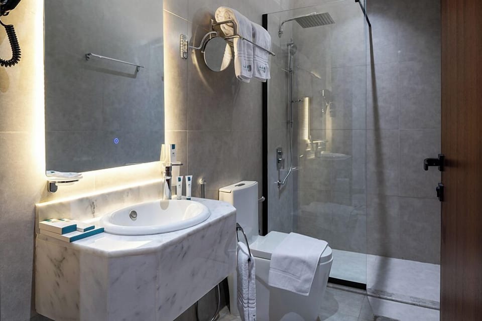 Separate tub and shower, free toiletries, hair dryer, slippers