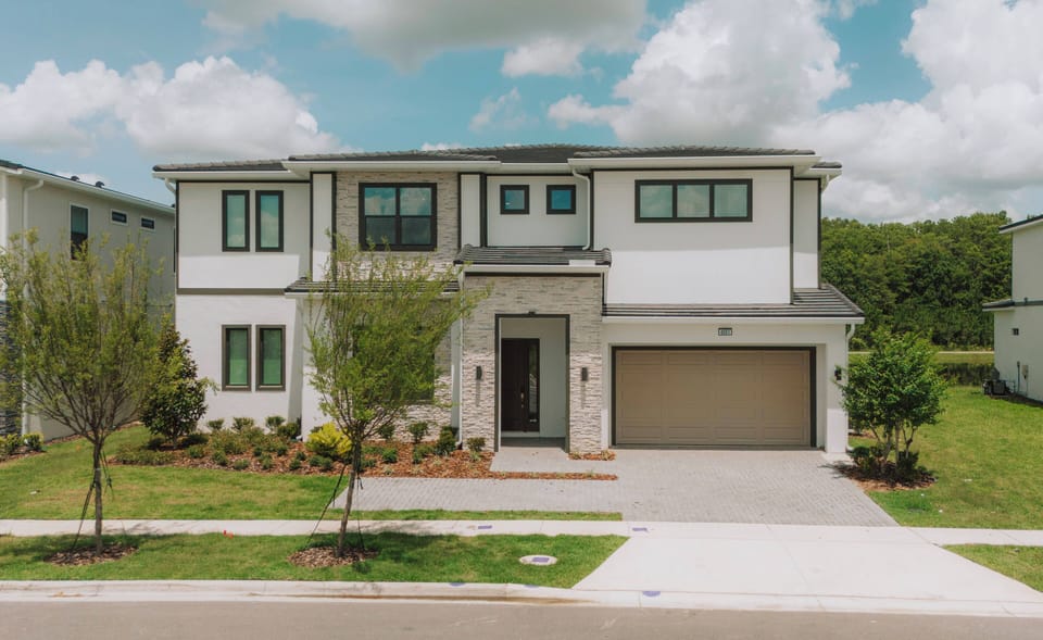 Discover the charm of this beautifully designed home with a light stone façade and large modern windows that fill the space with natural light. Enjoy the tranquil, manicured landscaping for a delightful and memorable stay.