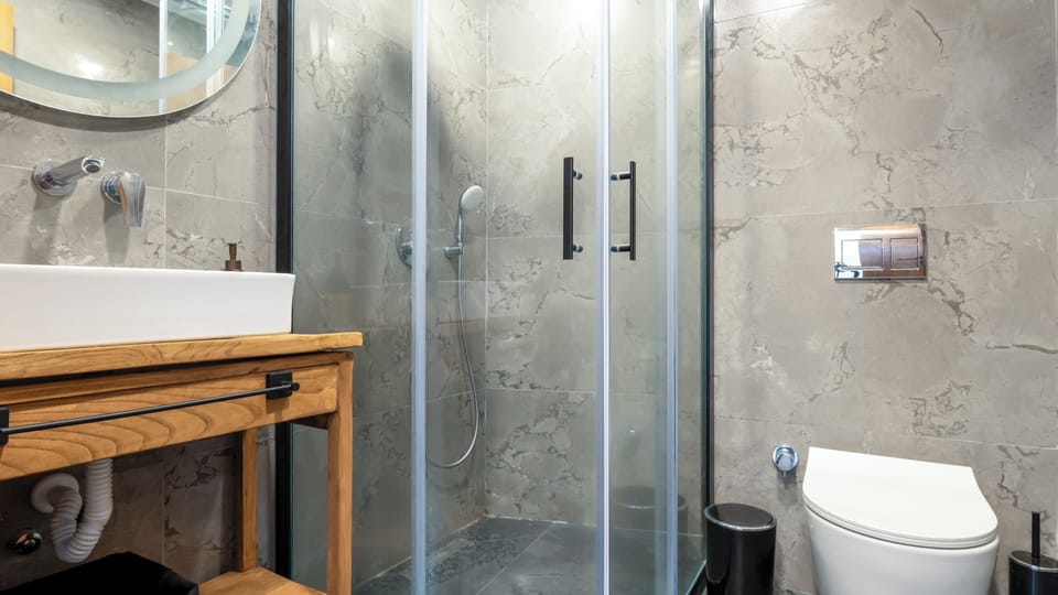 Deluxe Double Room, Balcony, City View | Bathroom | Shower, hair dryer, slippers, towels
