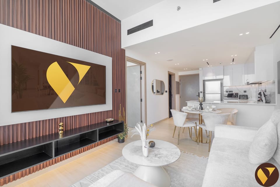 Luxury Apartment, Balcony, City View | Living area | 65-inch Smart TV with cable channels