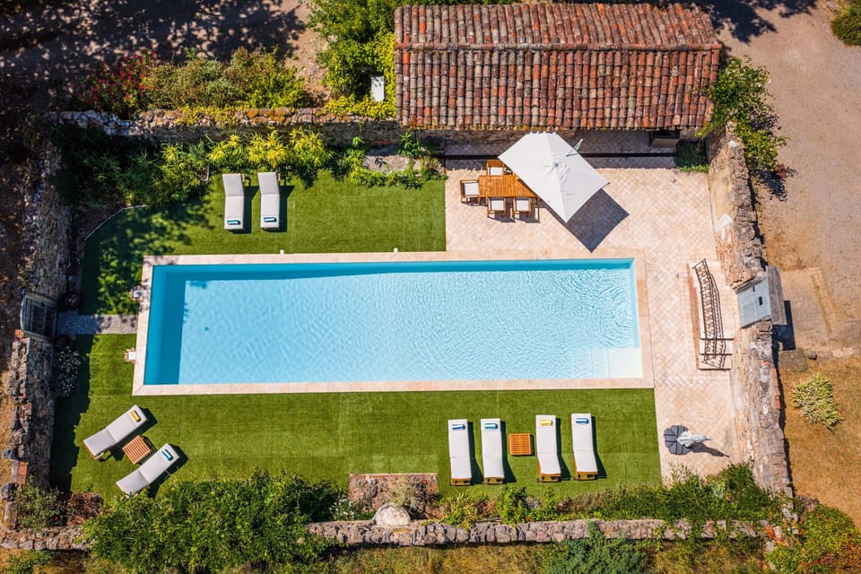 Heated swimming pool (16 x 4 m) - Sun loungers, parasols, table and chairs - Pool house with sofas, small refrigerator, kettle and cups - Terraces with furniture - Patio with fountain - Private parking.
