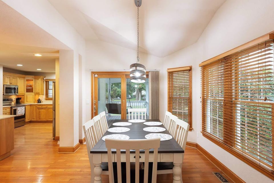 Mid Level: Dining Area just off the kitchen with plenty of natural light and easy access to the front deck
