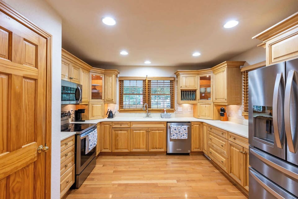 Mid Level: Fully Stocked Kitchen with refrigerator, stove, oven, microwave, sink, dishwasher, coffee maker and everything needed for group cooking