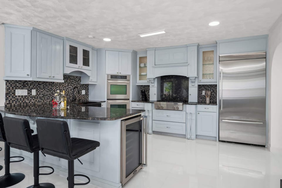 Whip up delicious meals in our stunning, fully equipped kitchen featuring sleek granite countertops and stainless steel appliances.