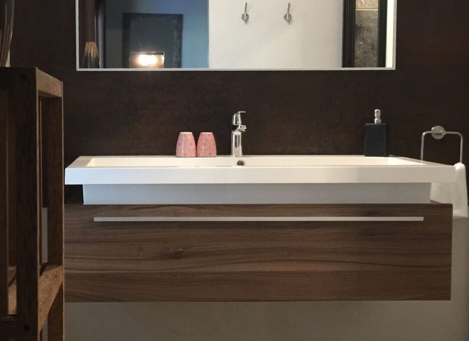 Your lodge with private hot tub | Bathroom | Shower, rainfall showerhead, hair dryer, soap