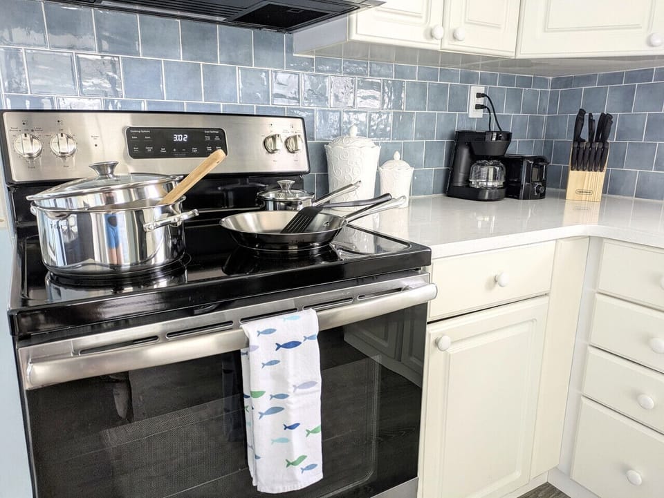 The kitchen is fully equipped to cook your favorite meals.