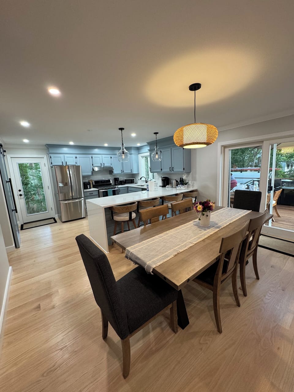 Dining area and kitchen island - sits 10 + smart TV