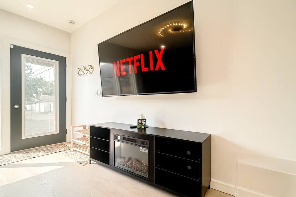 Settle in for movie nights on the large TV while enjoying comfortable seating and an inviting atmosphere. This space is designed for relaxing and spending time together after a busy day.