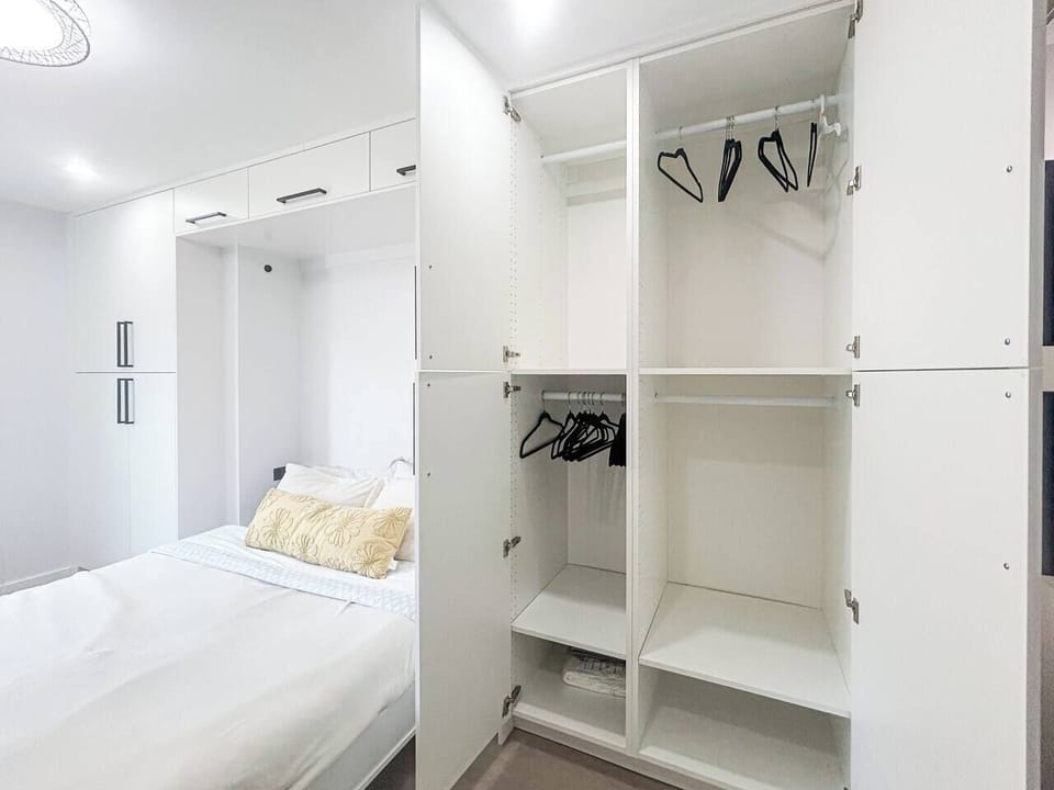 The walk-in closet provides ample storage for clothing, luggage, and travel essentials, helping keep the bedroom organized and giving guests extra space to unpack and make themselves comfortable.