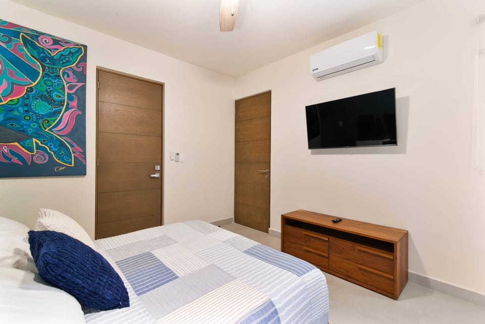 Third bedroom with private bath, Smart TV, AC, fan & room-darkening shades.