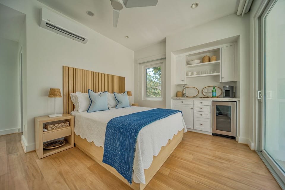 Third floor suite with queen bed. Accessible via exterior staircase