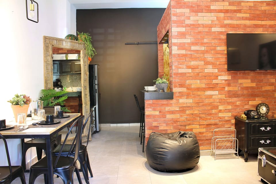 Deluxe Apartment | Living area | 38-inch Smart TV with digital channels, Netflix, first-run movies