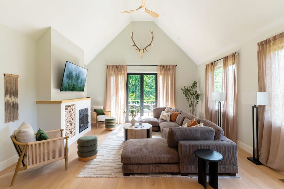 Our Scandinavian-inspired, bright and airy living room feature vaulted ceilings.