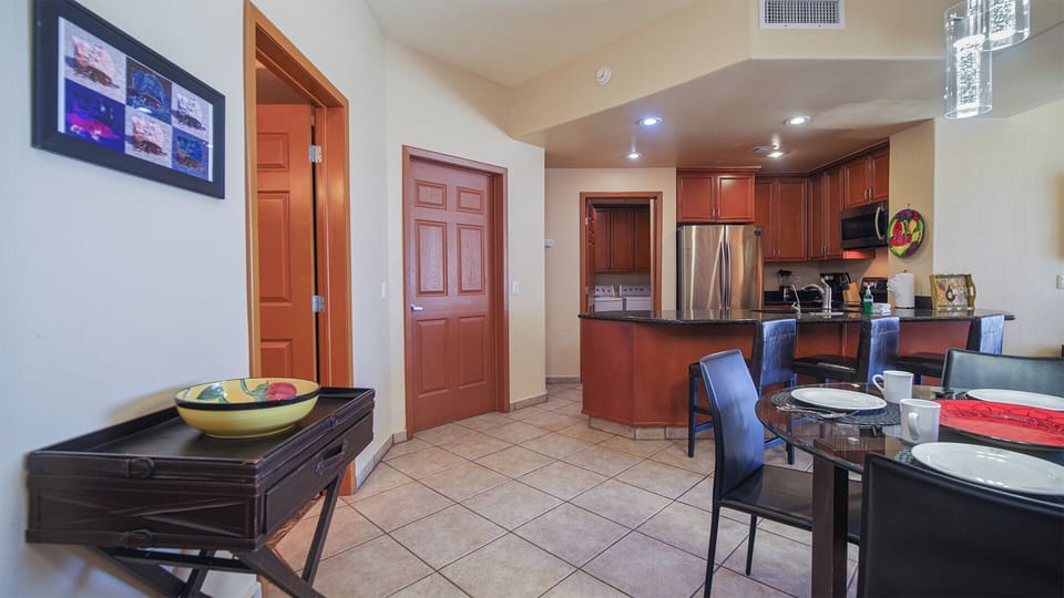 Dining table and kitchen.