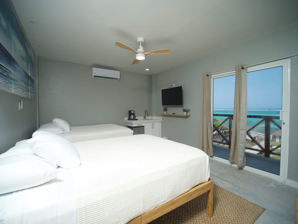 Premium Quadruple Room, 2 Queen Beds, Balcony, Ocean View | Beach/ocean view