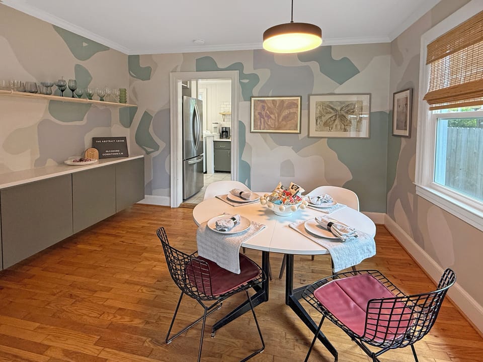 Dining room with hand painted mural by Kristen Martinez