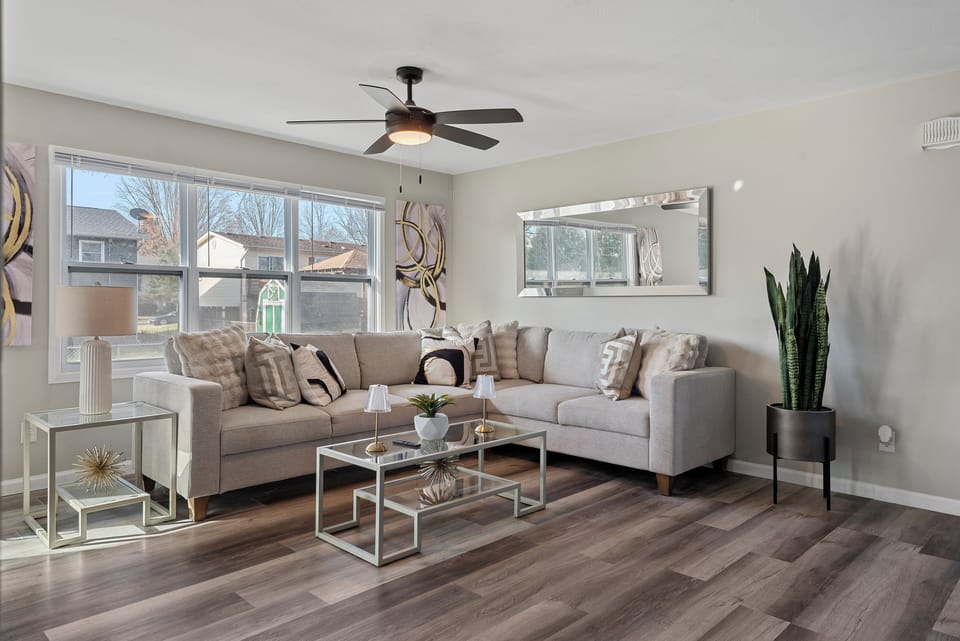 Main Level-Modern & bright! Relax in this chic living space a stylish sectional,