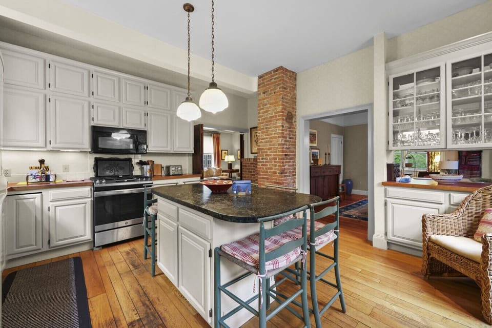 Fully equipped kitchen with ample counter space and modern appliances.