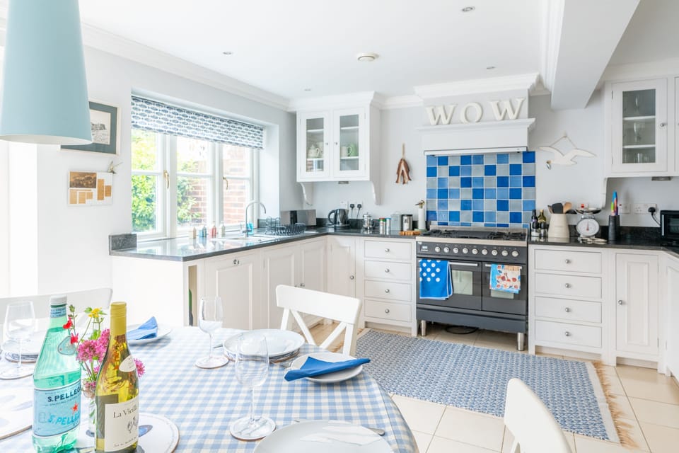 Ground floor: Kitchen with gas hob, electric oven, dishwasher, microwave, fridge-freezer, and Nespresso coffee machine