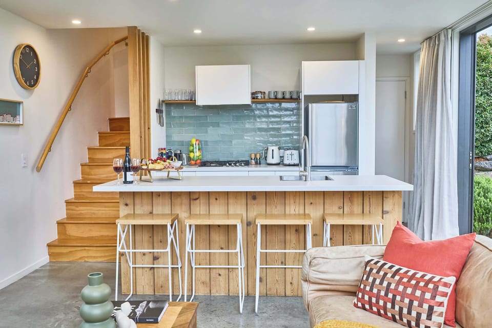 Kitchen Oasis: Sleek design meets warm wood finishes, perfect for culinary adventures!