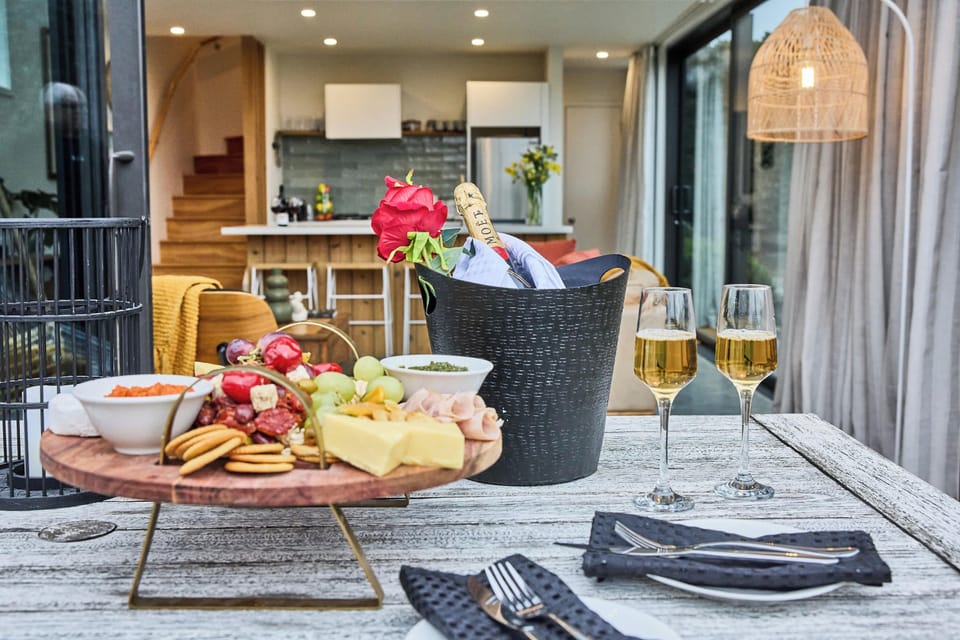 Dining Area: Savor local flavors with a gourmet spread and bubbly, amidst stunning views!