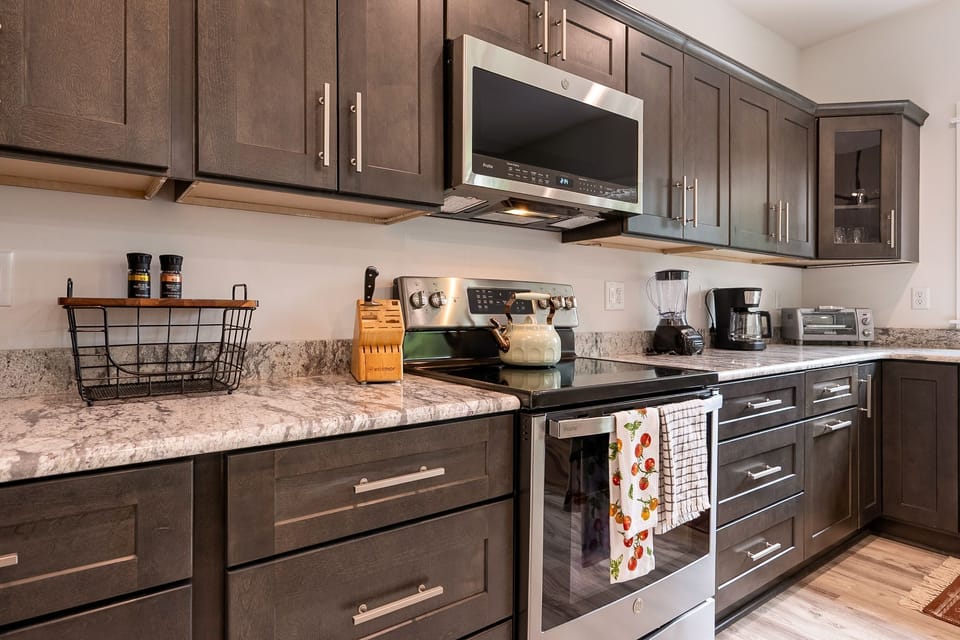 Granite countertops and modern appliances.