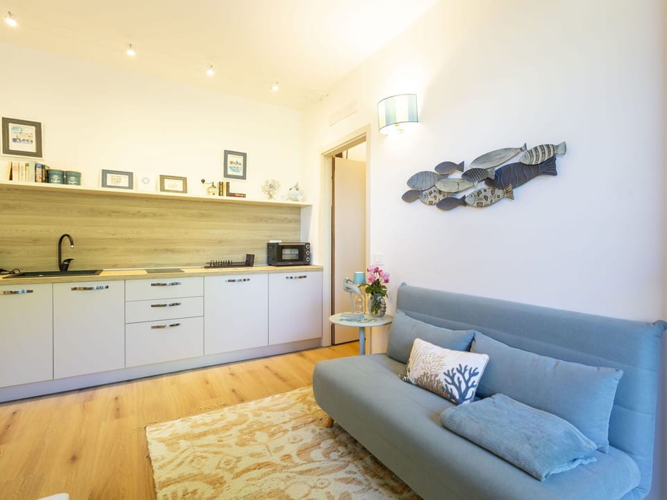 Furniture, Interior Design, Flooring, Floor, Wood, Room, Couch, Ceiling, Lighting, Textile