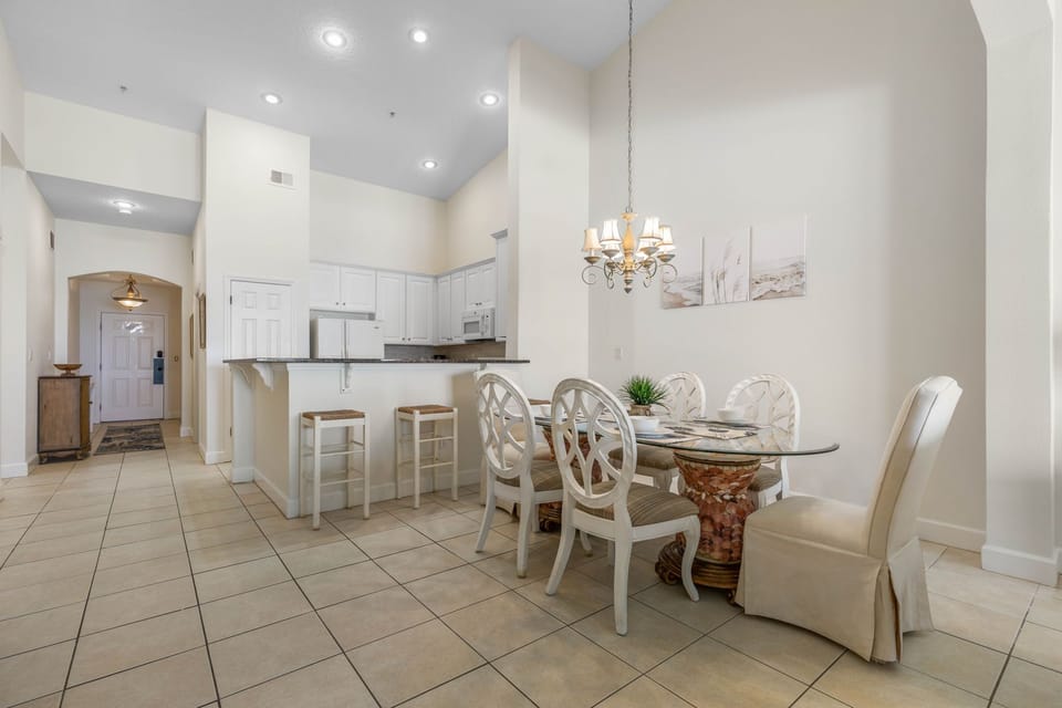 Dining table for 6 with additional seating at the kitchen counter.