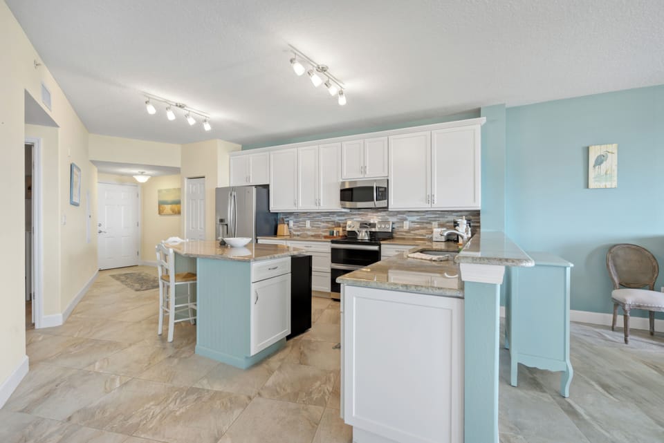 Kitchen has island great from prep and additional seating.