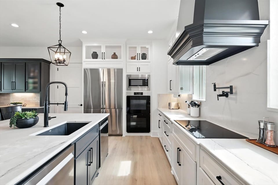 Fully equipped for all your cooking needs, this kitchen’s high-end finishes, an oversized center kitchen island, and top-of-the-line appliances offer the best of luxury living!
