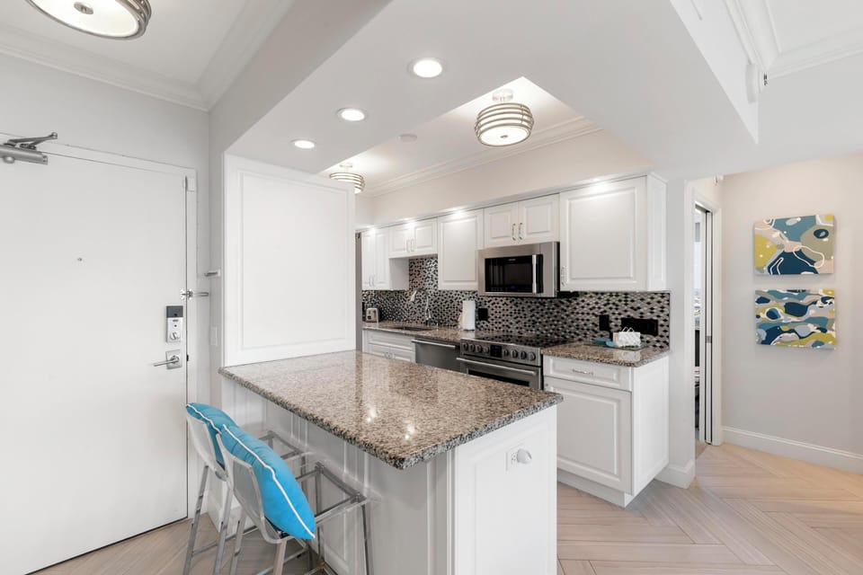 Well appointed kitchen with casual seating bar