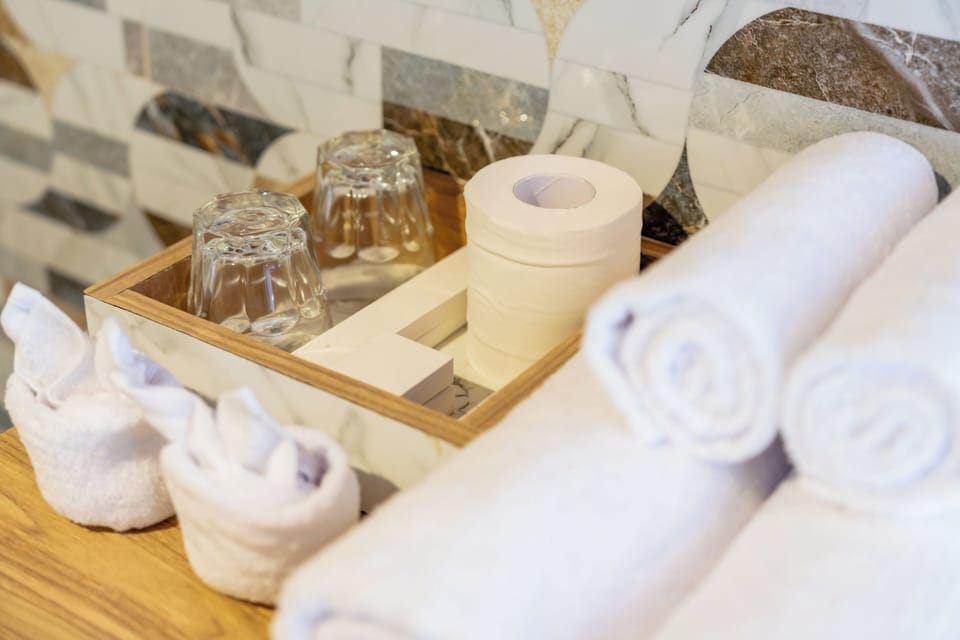 Deluxe Suite, Mountain View | Bathroom | Shower, free toiletries, slippers, soap