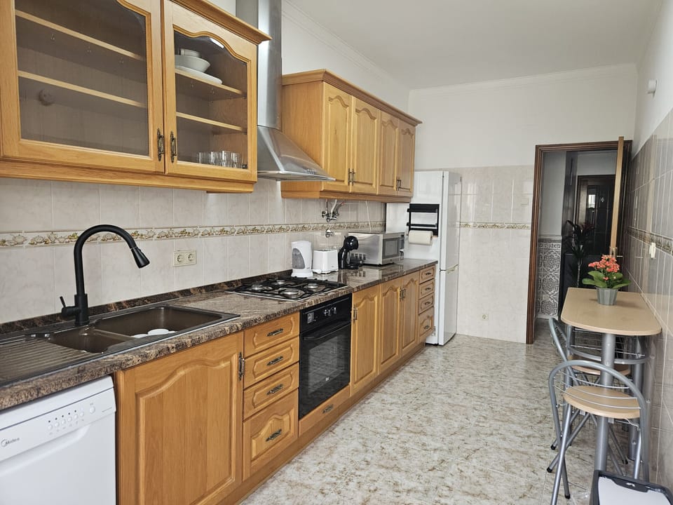Spacious kitchen with wooden cabinets