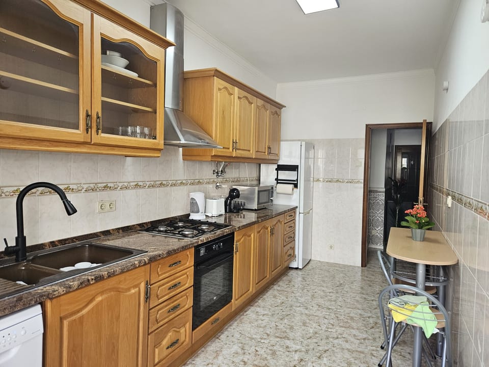 Spacious kitchen with wooden cabinets