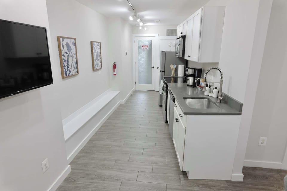 Modern appliances including a dishwasher, stovetop and oven!