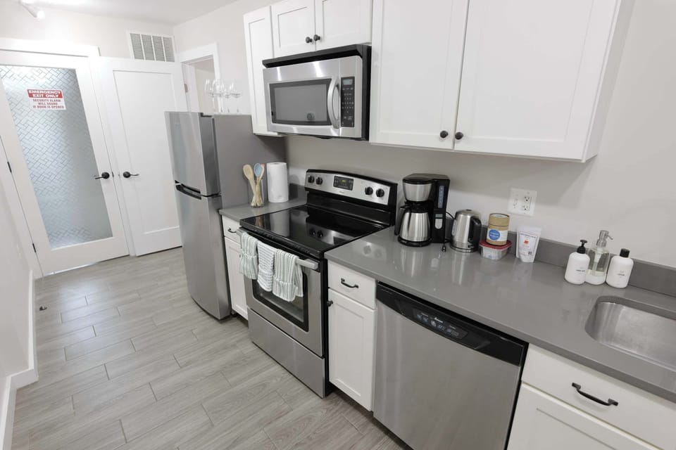 Modern appliances including a dishwasher, stovetop and oven!