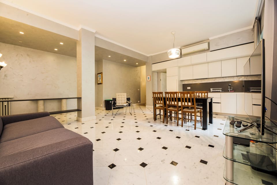Apartment, 2 Bedrooms, Balcony, Courtyard View | Living area | 32-inch flat-screen TV with cable channels