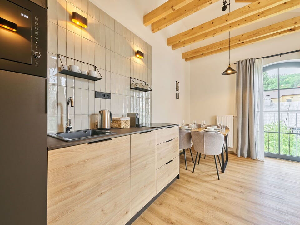 Wood, Furniture, Interior Design, Countertop, Flooring, Kitchen, Floor, Cabinetry, Room, Home